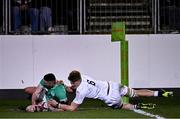 8 March 2024; Ben O'Connor of Ireland dives over to score his side's second try despite the tackle of Finn Carnduff of England during the U20 Six Nations Rugby Championship match between England and Ireland at The Recreation Ground in Bath, England. Photo by Harry Murphy/Sportsfile
