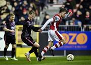 8 March 2024; Kian Leavy of St Patrick's Athletic in action against Hayden Muller of Dundalk during the SSE Airtricity Men's Premier Division match between St Patrick's Athletic and Dundalk at Richmond Park in Dublin. Photo by Piaras Ó Mídheach/Sportsfile