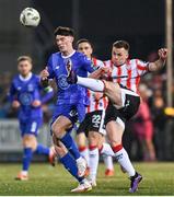 8 March 2024; Ben Doherty of Derry City in action against Harvey Macadam of Waterford during the SSE Airtricity Men's Premier Division match between Derry City and Waterford at The Ryan McBride Brandywell Stadium in Derry. Photo by Ramsey Cardy/Sportsfile