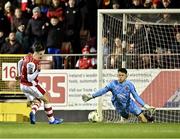 8 March 2024; Ruairí Keating of St Patrick's Athletic shoots to score his side's first goal, past Dundalk goalkeeper Ross Munro during the SSE Airtricity Men's Premier Division match between St Patrick's Athletic and Dundalk at Richmond Park in Dublin. Photo by Piaras Ó Mídheach/Sportsfile