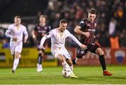 8 March 2024; Liam Burt of Shelbourne in action against Dayle Rooney of Bohemians during the SSE Airtricity Men's Premier Division match between Bohemians and Shelbourne at Dalymount Park in Dublin. Photo by Stephen McCarthy/Sportsfile
