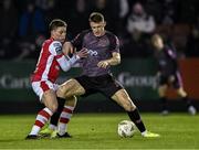 8 March 2024; Zak Bradshaw of Dundalk in action against Kian Leavy of St Patrick's Athletic during the SSE Airtricity Men's Premier Division match between St Patrick's Athletic and Dundalk at Richmond Park in Dublin. Photo by Piaras Ó Mídheach/Sportsfile