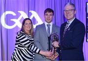 8 March 2024; Fintan Burke of St Thomas', centre, is presented with his AIB GAA Club Hurling Team of the Year Award by AIB Head of Marketing Engagement Nuala Kroondijk and Uachtarán Chumann Lúthchleas Gael Jarlath Burns during the AIB GAA Club Players Awards, held at Croke Park in Dublin. Photo by Sam Barnes/Sportsfile