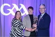 8 March 2024; Shane Cooney of St Thomas', centre, is presented with his AIB GAA Club Hurling Team of the Year Award by AIB Head of Marketing Engagement Nuala Kroondijk and Uachtarán Chumann Lúthchleas Gael Jarlath Burns during the AIB GAA Club Players Awards, held at Croke Park in Dublin. Photo by Sam Barnes/Sportsfile