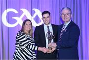 8 March 2024; Paddy Deegan of O'Loughlin Gaels, centre, is presented with his AIB GAA Club Hurling Team of the Year Award by AIB Head of Marketing Engagement Nuala Kroondijk and Uachtarán Chumann Lúthchleas Gael Jarlath Burns during the AIB GAA Club Players Awards, held at Croke Park in Dublin. Photo by Sam Barnes/Sportsfile