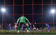8 March 2024; Patrick Hoban of Derry City shoots to score his and his side's second goal past Waterford goalkeeper Sam Sargeant during the SSE Airtricity Men's Premier Division match between Derry City and Waterford at The Ryan McBride Brandywell Stadium in Derry. Photo by Ramsey Cardy/Sportsfile