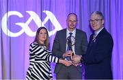 8 March 2024; Scotstown manager David McCague, centre, is presented with the AIB Club Football Team of the Year Award on behalf of Rory Beggan of Scotstown by AIB Head of Marketing Engagement Nuala Kroondijk and Uachtarán Chumann Lúthchleas Gael Jarlath Burns during the AIB GAA Club Players Awards, held at Croke Park in Dublin. Photo by Sam Barnes/Sportsfile