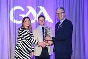 8 March 2024; Eunan Mulholland of Watty Grahams, Glen, centre, is presented with the AIB Club Football Team of the Year Award by AIB Head of Marketing Engagement Nuala Kroondijk and Uachtarán Chumann Lúthchleas Gael Jarlath Burns during the AIB GAA Club Players Awards, held at Croke Park in Dublin. Photo by Sam Barnes/Sportsfile