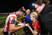 8 March 2024; Patrick Hoban of Derry City signs autographs for supporters after the SSE Airtricity Men's Premier Division match between Derry City and Waterford at The Ryan McBride Brandywell Stadium in Derry. Photo by Ramsey Cardy/Sportsfile