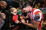 8 March 2024; Patrick Hoban of Derry City signs autographs for supporters after the SSE Airtricity Men's Premier Division match between Derry City and Waterford at The Ryan McBride Brandywell Stadium in Derry. Photo by Ramsey Cardy/Sportsfile