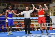 8 March 2024; Jude Gallagher of Ireland, right, is declared victorious over Uddin Mohammed Hussam of India during their Men's 57kg Round of 32 bout during day six at the Paris 2024 Olympic Boxing Qualification Tournament at E-Work Arena in Busto Arsizio, Italy. Photo by Ben McShane/Sportsfile