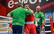 8 March 2024; Jude Gallagher of Ireland celebrates with Ireland coach Zaur Antia, left, after his victory in the Men's 57kg Round of 32 bout against Uddin Mohammed Hussam of India during day six at the Paris 2024 Olympic Boxing Qualification Tournament at E-Work Arena in Busto Arsizio, Italy. Photo by Ben McShane/Sportsfile