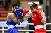 8 March 2024; Jude Gallagher of Ireland, right, in action against Uddin Mohammed Hussam of India during their Men's 57kg Round of 32 bout during day six at the Paris 2024 Olympic Boxing Qualification Tournament at E-Work Arena in Busto Arsizio, Italy. Photo by Ben McShane/Sportsfile