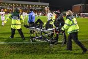 8 March 2024; A steward is stretchered from the pitch during the closing stages of the SSE Airtricity Men's Premier Division match between Bohemians and Shelbourne at Dalymount Park in Dublin. Photo by Stephen McCarthy/Sportsfile