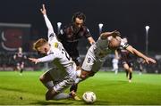 8 March 2024; Gavin Molloy, left, and Mark Coyle of Shelbourne are tackled by Dylan Connolly of Bohemians during the SSE Airtricity Men's Premier Division match between Bohemians and Shelbourne at Dalymount Park in Dublin. Photo by Shauna Clinton/Sportsfile