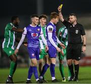 8 March 2024; Evan O'Connor of Treaty United is shown a yellow card by referee Declan Toland during the SSE Airtricity Men's First Division match between Treaty United and Bray Wanderers at Markets Field in Limerick. Photo by Michael P Ryan/Sportsfile
