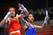 9 March 2024; Sofia Micaela Robles of Argentina, left, and Shera Mae Patricio of USA after their Women's 54kg Round of 16 bout during day seven at the Paris 2024 Olympic Boxing Qualification Tournament at E-Work Arena in Busto Arsizio, Italy. Photo by Ben McShane/Sportsfile