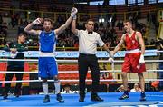 9 March 2024; Saparmyrat Roskowicz of Turkmenistan, left, is declared victorious over Bartlomiej Roskowicz of Poland after their Men's 63.5kg Round of 16 bout during day seven at the Paris 2024 Olympic Boxing Qualification Tournament at E-Work Arena in Busto Arsizio, Italy. Photo by Ben McShane/Sportsfile