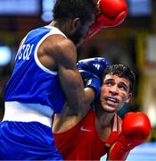 9 March 2024; Jesus Cova of Venezuela, right, in action against Jose Manuel Viafara of Columbia during their Men's 63.5kg Round of 16 bout during day seven at the Paris 2024 Olympic Boxing Qualification Tournament at E-Work Arena in Busto Arsizio, Italy. Photo by Ben McShane/Sportsfile