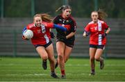 9 March 2024; Orlaith Cahalane of MTU Cork in action against Eve Power of UCC during the 2024 Ladies HEC Lynch Cup final match between Munster Technological University Cork and University College Cork at MTU Cork. Photo by Brendan Moran/Sportsfile
