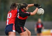 9 March 2024; Eve Power of UCC in action against Shannon Morrissey of MTU Cork during the 2024 Ladies HEC Lynch Cup final match between Munster Technological University Cork and University College Cork at MTU Cork. Photo by Brendan Moran/Sportsfile