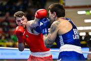 9 March 2024; Martin McDonagh of Ireland, left, in action against Danis Latypov of Bahrain during their Men's 92+kg Round of 16 bout during day seven at the Paris 2024 Olympic Boxing Qualification Tournament at E-Work Arena in Busto Arsizio, Italy. Photo by Ben McShane/Sportsfile