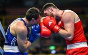 9 March 2024; Martin McDonagh of Ireland, right, in action against Danis Latypov of Bahrain during their Men's 92+kg Round of 16 bout during day seven at the Paris 2024 Olympic Boxing Qualification Tournament at E-Work Arena in Busto Arsizio, Italy. Photo by Ben McShane/Sportsfile