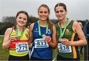9 March 2024; Senior girls 3500m medallists, Anna Gardiner of Assumption GS, Down, centre, gold, Lucy Foster of Down HS Downpatrick, right, silver, and Meabh Eakin of Ballymakenny College, Louth, left, bronze, during the 123.ie All Ireland Schools Cross Country Championships at Tymon Park in Tallaght, Dublin. Photo by Sam Barnes/Sportsfile
