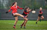 9 March 2024; Eve Power of UCC blocks a shot by Aoife McTaggart of MTU Cork during the 2024 Ladies HEC Lynch Cup final match between Munster Technological University Cork and University College Cork at MTU Cork. Photo by Brendan Moran/Sportsfile