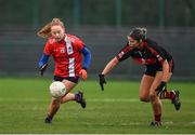 9 March 2024; Orlaith Cahalane of MTU Cork in action against Eve Power of UCC during the 2024 Ladies HEC Lynch Cup final match between Munster Technological University Cork and University College Cork at MTU Cork. Photo by Brendan Moran/Sportsfile