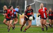 9 March 2024; Eve Power of UCC in action against Helen Cleere of MTU Cork during the 2024 Ladies HEC Lynch Cup final match between Munster Technological University Cork and University College Cork at MTU Cork. Photo by Brendan Moran/Sportsfile