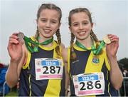 9 March 2024; Junior girls 2500m medallists and sisters Holly Renton, left, bronze, and Freya Renton, gold, both of SH Westport, Mayo, during the 123.ie All Ireland Schools Cross Country Championships at Tymon Park in Tallaght, Dublin. Photo by Sam Barnes/Sportsfile