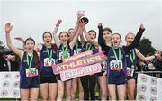 9 March 2024; The Lourdes Enniskillen team, Fermanagh, celebrate with the cup after winning minor girls 2000m team event during the 123.ie All Ireland Schools Cross Country Championships at Tymon Park in Tallaght, Dublin. Photo by Sam Barnes/Sportsfile