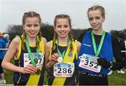 9 March 2024; Junior girls 2500m medallists Freya Renton, centre gold,SH Westport, Mayo, Emma Haugh of St Flannans Ennis, Clare, right, silver, and Holly Renton of SH Westport, Mayo, left, bronze, during the 123.ie All Ireland Schools Cross Country Championships at Tymon Park in Tallaght, Dublin. Photo by Sam Barnes/Sportsfile