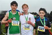 9 March 2024; Minor boys 2500m medallists, Darragh Whelan of Castletroy College, Limerick, centre, gold, Ethan Bramhill of Greystones CC, Wicklow, right, silver, and Ryan Vickers of St Brendans Killarney, Kerry, left, bronze, during the 123.ie All Ireland Schools Cross Country Championships at Tymon Park in Tallaght, Dublin. Photo by Sam Barnes/Sportsfile