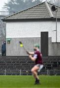 9 March 2024; A spectator looks on as David Williams of Westmeath takes a free during the Allianz Hurling League Division 1 Group B match between Westmeath and Antrim at TEG Cusack Park in Mullingar, Westmeath. Photo by Piaras Ó Mídheach/Sportsfile