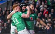 9 March 2024; James Lowe of Ireland celebrates with teammates Ciarán Frawley, left, and Caelan Doris after scoring their side's first try, in the 44th minute, during the Guinness Six Nations Rugby Championship match between England and Ireland at Twickenham Stadium in London, England. Photo by David Fitzgerald/Sportsfile