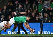 9 March 2024; James Lowe of Ireland dives over to score his side's second try, in 73rd minute, despite the tackle of Elliot Daly of England during the Guinness Six Nations Rugby Championship match between England and Ireland at Twickenham Stadium in London, England. Photo by Harry Murphy/Sportsfile