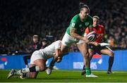 9 March 2024; James Lowe of Ireland on his way to scoring his side's second try, in 73rd minute, despite the tackle of Elliot Daly of England during the Guinness Six Nations Rugby Championship match between England and Ireland at Twickenham Stadium in London, England. Photo by David Fitzgerald/Sportsfile