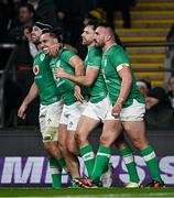 9 March 2024; James Lowe of Ireland, second left, celebrates with teammates, from left, Caelan Doris, Hugo Keenan and Rónan Kelleher, after scoring their side's second try during the Guinness Six Nations Rugby Championship match between England and Ireland at Twickenham Stadium in London, England. Photo by Harry Murphy/Sportsfile