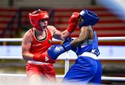 9 March 2024; Grainne Walsh of Ireland, left, in action against Asiko Friza Anyango of Kenya during their Women's 66kg Round of 16 bout during day seven at the Paris 2024 Olympic Boxing Qualification Tournament at E-Work Arena in Busto Arsizio, Italy. Photo by Ben McShane/Sportsfile