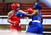 9 March 2024; Grainne Walsh of Ireland, left, in action against Asiko Friza Anyango of Kenya during their Women's 66kg Round of 16 bout during day seven at the Paris 2024 Olympic Boxing Qualification Tournament at E-Work Arena in Busto Arsizio, Italy. Photo by Ben McShane/Sportsfile