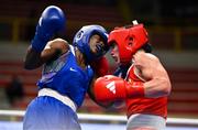 9 March 2024; Grainne Walsh of Ireland, right, in action against Asiko Friza Anyango of Kenya during their Women's 66kg Round of 16 bout during day seven at the Paris 2024 Olympic Boxing Qualification Tournament at E-Work Arena in Busto Arsizio, Italy. Photo by Ben McShane/Sportsfile