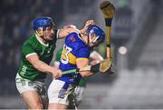 9 March 2024; Jason Forde of Tipperary holds off Mike Casey of Limerick on his way to scoring his side's first goal during the Allianz Hurling League Division 1 Group B match between Limerick and Tipperary at SuperValu Páirc Uí Chaoimh in Cork. Photo by Seb Daly/Sportsfile