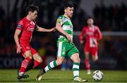 9 March 2024; Aaron Greene of Shamrock Rovers in action against Niall Morahan of Sligo Rovers during the SSE Airtricity Men's Premier Division match between Sligo Rovers and Shamrock Rovers at The Showgrounds in Sligo. Photo by Stephen McCarthy/Sportsfile