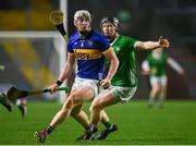 9 March 2024; Eoghan Connolly of Tipperary in action against Peter Casey of Limerick during the Allianz Hurling League Division 1 Group B match between Limerick and Tipperary at SuperValu Páirc Uí Chaoimh in Cork. Photo by Seb Daly/Sportsfile
