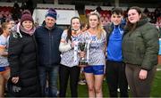 9 March 2024; Family and friends of the late Ella O'Neill, from left, mother Josephine, father JJ, sister Aoife, Ella McNamara of ATU Sligo, brother Darragh and friend Julianne Murphy with the Moynihan Cup after the 2024 Ladies HEC Moynihan Cup final match between Atlantic Technological University Sligo and Mary Immaculate College Limerick at MTU Cork. Photo by Brendan Moran/Sportsfile