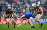 10 March 2024; Peter Duggan of Clare is tackled by Mikey Carey,right, and Mikey Butler of Kilkenny during the Allianz Hurling League Division 1 Group A match between Clare and Kilkenny at Cusack Park in Ennis, Clare. Photo by Ray McManus/Sportsfile