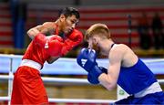 10 March 2024; Rogen Ladon of Philipines, left, in action against Kiaran MacDonald of Great Britain during their Men's 51kg Round of 16 bout during day eight at the Paris 2024 Olympic Boxing Qualification Tournament at E-Work Arena in Busto Arsizio, Italy. Photo by Ben McShane/Sportsfile