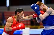 10 March 2024; Rogen Ladon of Philipines, left, in action against Kiaran MacDonald of Great Britain during their Men's 51kg Round of 16 bout during day eight at the Paris 2024 Olympic Boxing Qualification Tournament at E-Work Arena in Busto Arsizio, Italy. Photo by Ben McShane/Sportsfile
